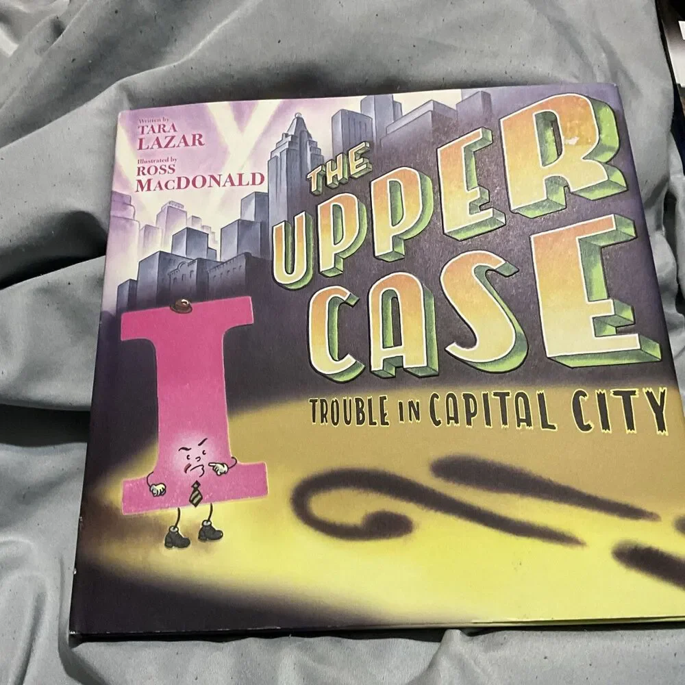 THE UPPER CASE TROUBLE IN CAPITAL CITY HARDCOVER W/ DUST COVER 1ST ED. 2019 NEW